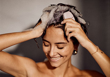Lathering Solid Shampoo Bar into Hair
