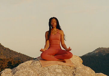 Woman in meditation while practising yoga. 
