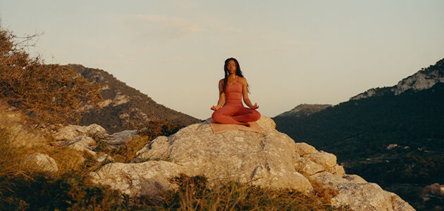 Woman in meditation while practising yoga. 