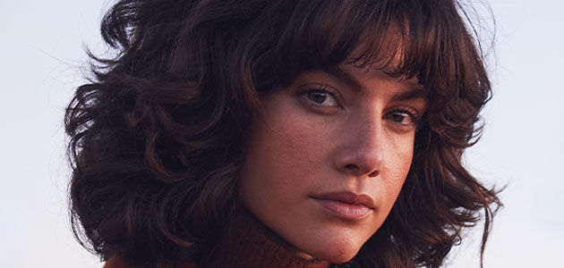Woman with radiant skin looking at the viewer