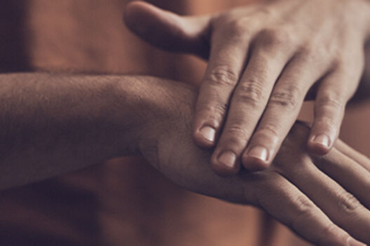 Man applying L&rsquo;OCCITANE Shea Intensive Hand Balm