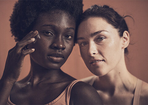 Image shows two women facing the audience