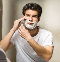 Man shaving using L'OCCITANE Cade Refreshing Shaving Gel