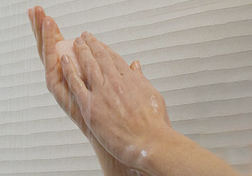 Lathering Solid Shampoo Bar with Hands