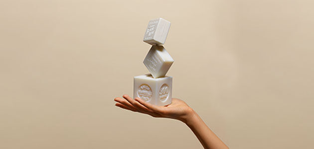 Woman holding L'OCCITANE Bonne M&egrave;re Extra Pure Soaps, Savon de Marseille, Provence 