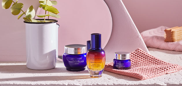The image shows the L'OCCITANE ImmortelleReset Serum, L'OCCITANE Immortelle Precious cream and L'OCCITANE Immortelle Precious Eye Balm