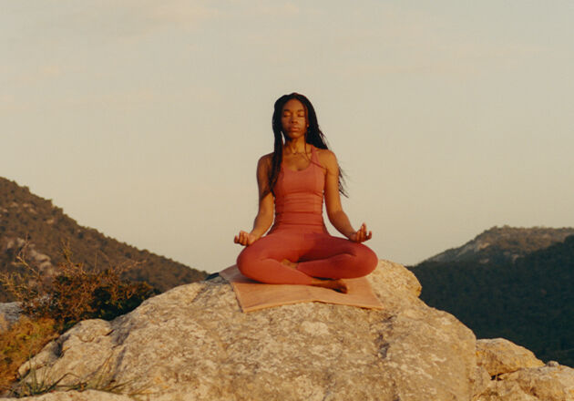 Woman in meditation while practising yoga. 