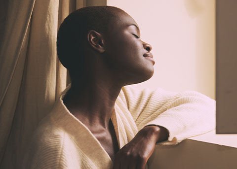 A woman looking through the window