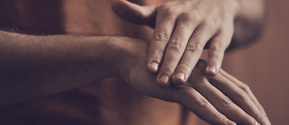 Man applying L&rsquo;OCCITANE Shea Intensive Hand Balm