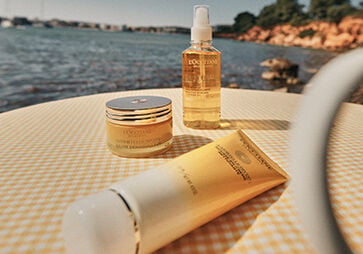This image shows the L'OCCITANE Immortelle range including the L'OCCITANE Immortelle Divine Cleansing Cream, L'OCCITANE Divine Cleansing Balm, L'OCCITANE Immortelle Precious Cleansing Oil