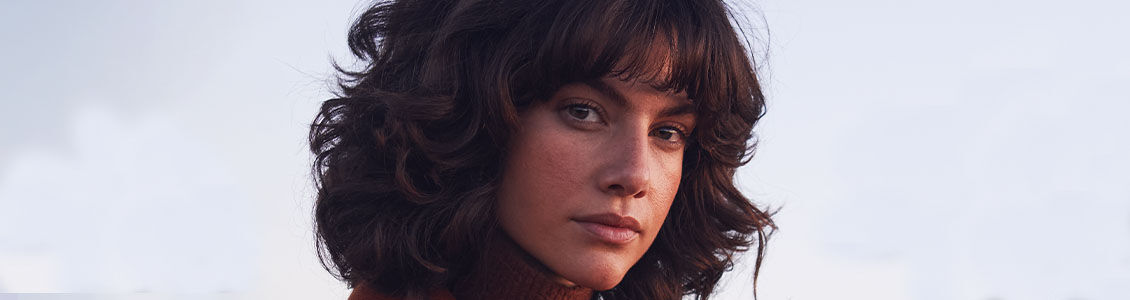 Woman with radiant skin looking at the viewer